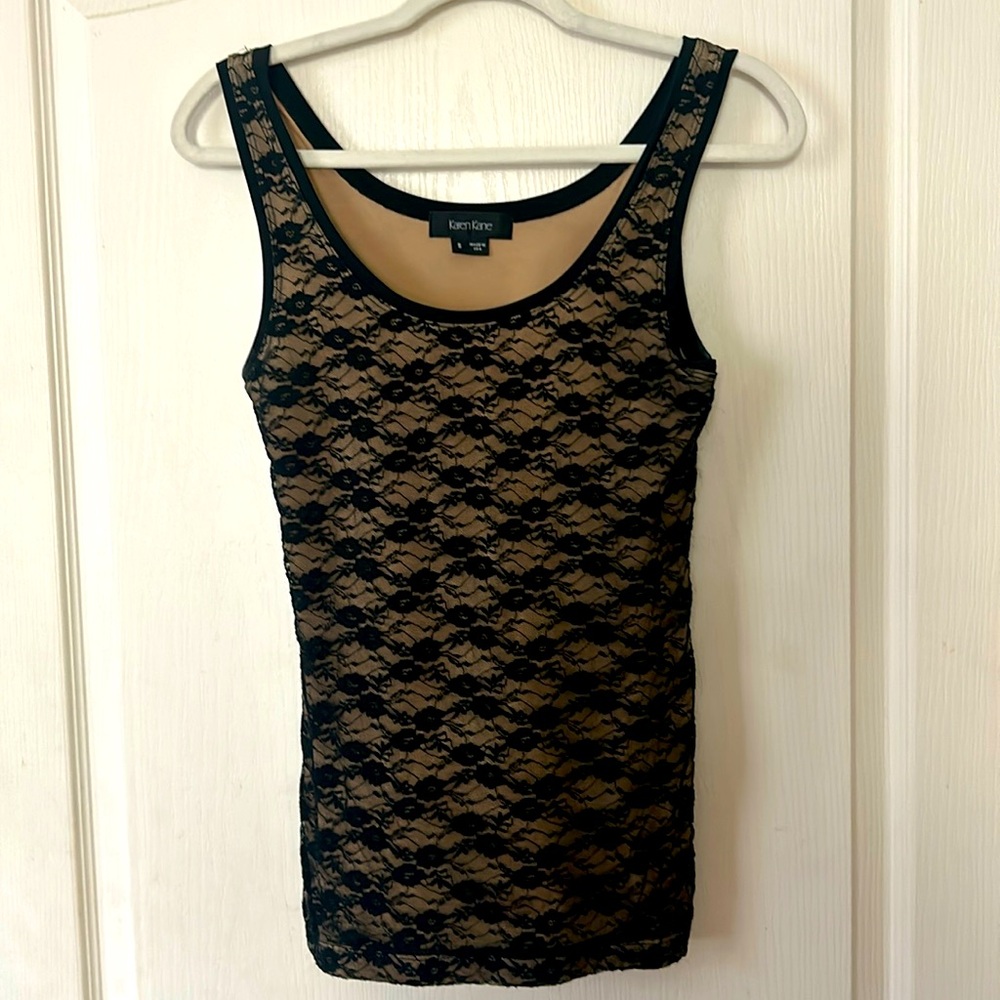 Trendy lace top, fully lined, stretchy. Looks great with slacks or skirts